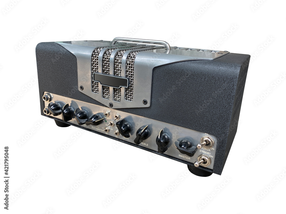 Isolated steel texture and black knob on the control panel of US Style modern electric guitar power amplifier for blues and rock genre on white background with clipping path. side view photo Isolated steel texture and black knob on the control panel of US Style modern electric guitar power amplifier for blues and rock genre on white background with clipping path. side view photo