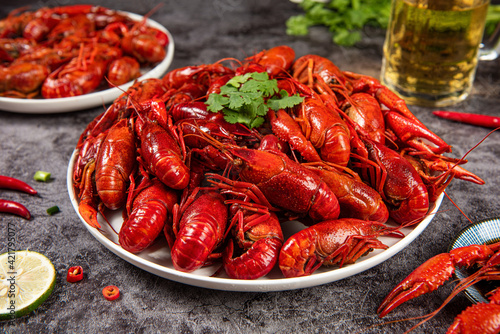 Boiled red crawfish or crayfish in plate on table photo