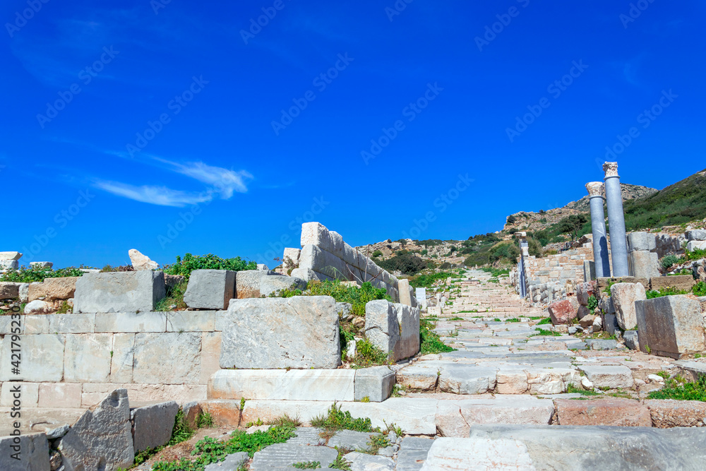 Ancient columns and marble stairs of antique city historical heritage ruins in Turkey , Datca province