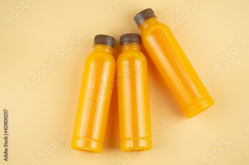 Plastic bottle 100 % fresh orange juice. Copy space