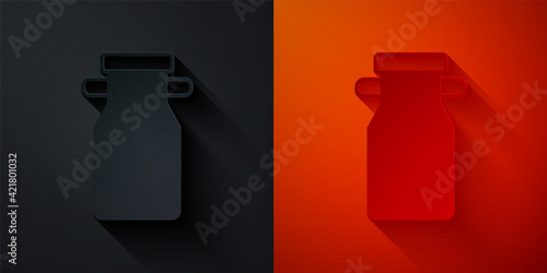 Paper cut Can container for milk icon isolated on black and red background. Paper art style. Vector