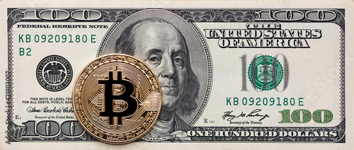 Bitcoin on 100 dollar banknote © Ruslan
