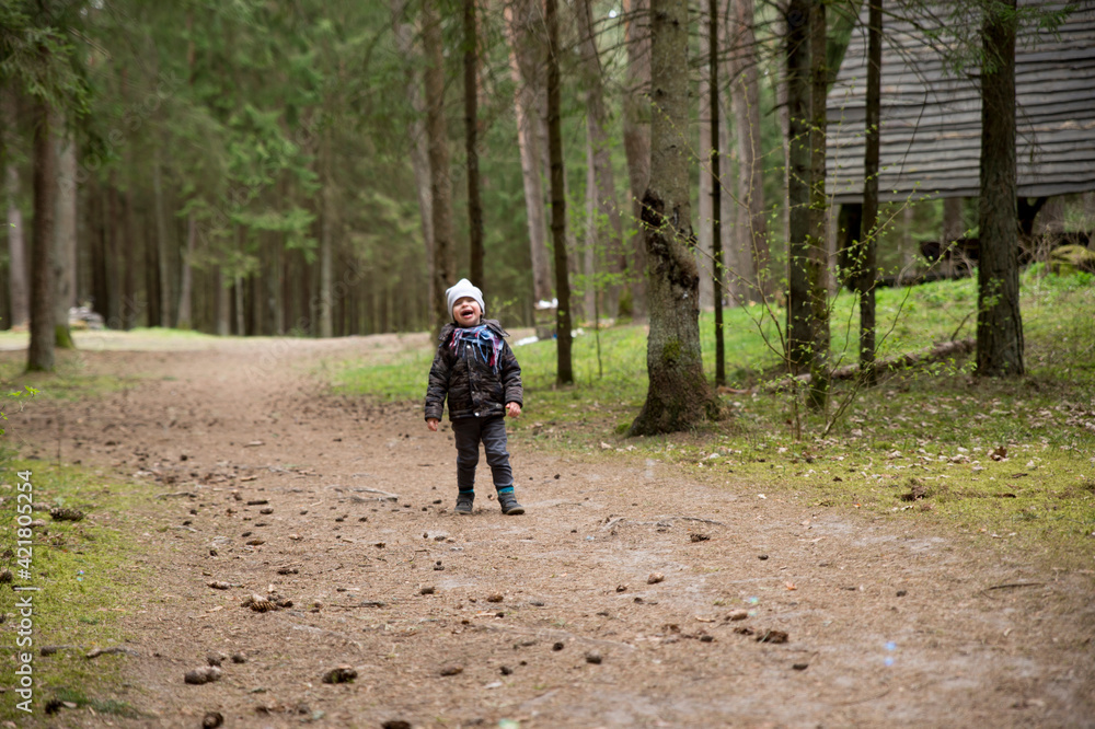 In the woods. Little boy in the forest. Spring activities. fresh air walk.