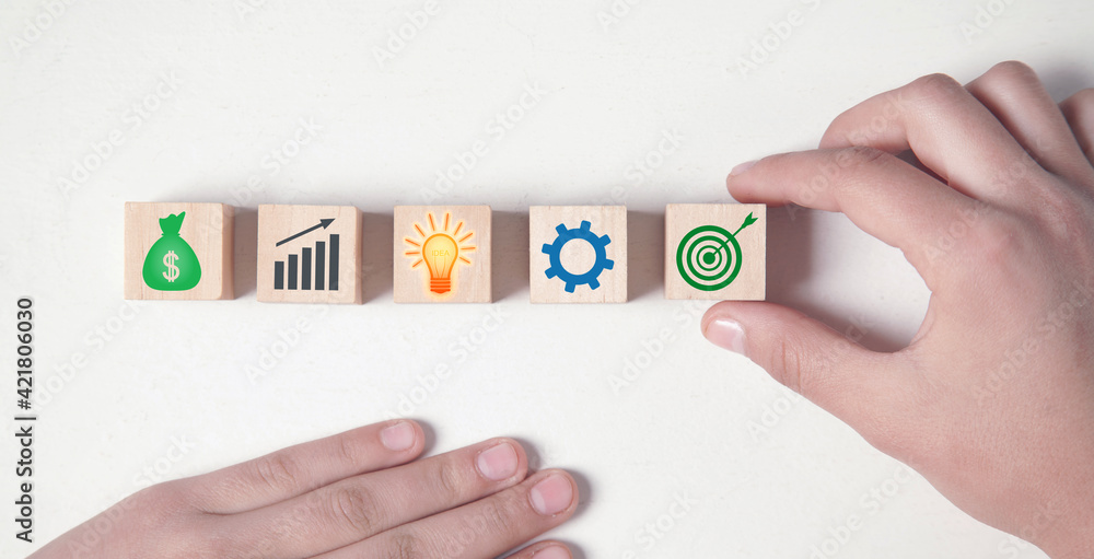 Business signs on wooden cubes. Business process. Goal. Achievement Business signs on wooden cubes. Business process. Goal. Achievement