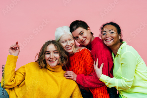 Fototapeta group of multiethnic women with different kind of skin posing together in studio