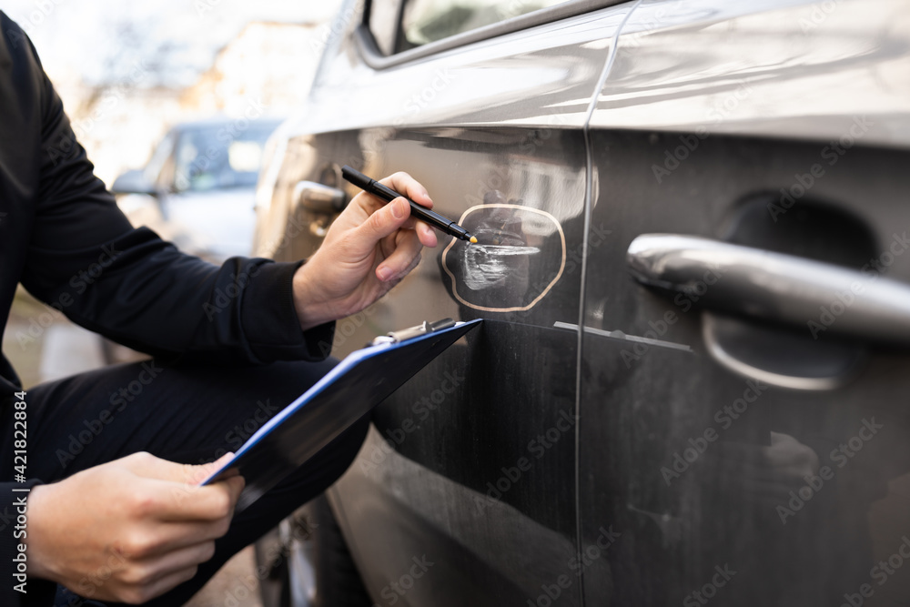 Insurance Agent Or Adjuster Inspecting Car Insurance Agent Or Adjuster Inspecting Car