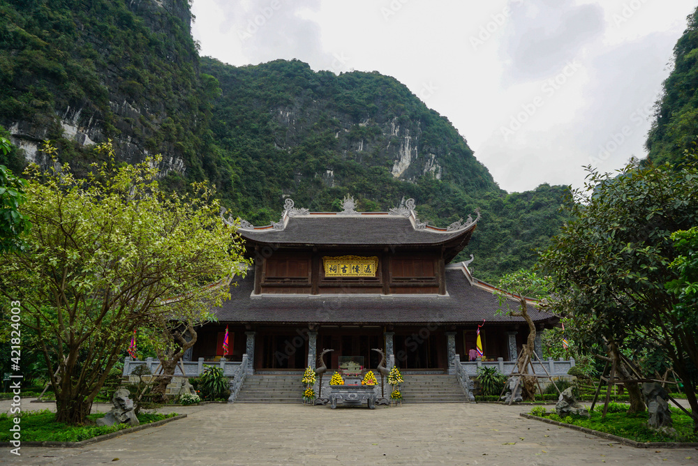 Ancient temple building between rocky mountains in Vietnam