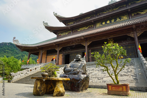 Buddha statue at the entrace of a temple in Vietnam photo