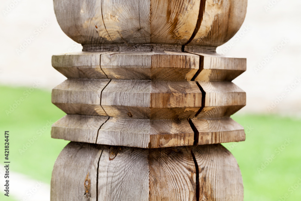 Decorative carved element of wooden column Decorative carved element of wooden column