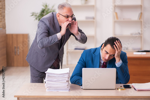 Two employees working in the office