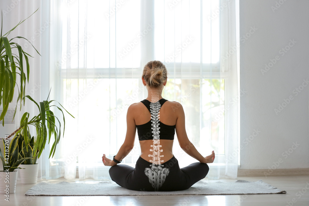 Young woman with good posture meditating at home, back view - obrazy, fototapety, plakaty 