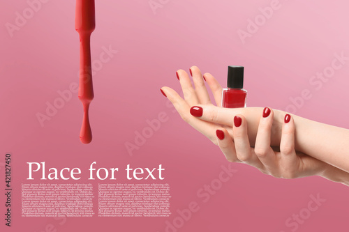 Hands with nail polish on c...