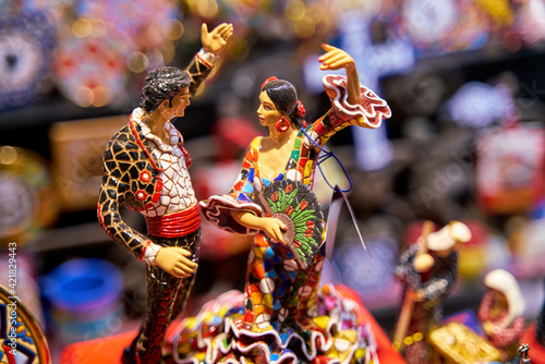 Close focus of memory of the city of Seville with a couple of figures dancing Sevillanas photo
