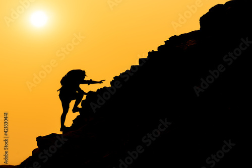 Photography Silhouette of Efforts of mountain climbers, Determination Success of business and his own refuge concept, Self-help