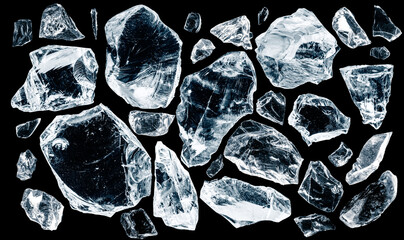 Set of different crushed ice pieces, isolated on black background.