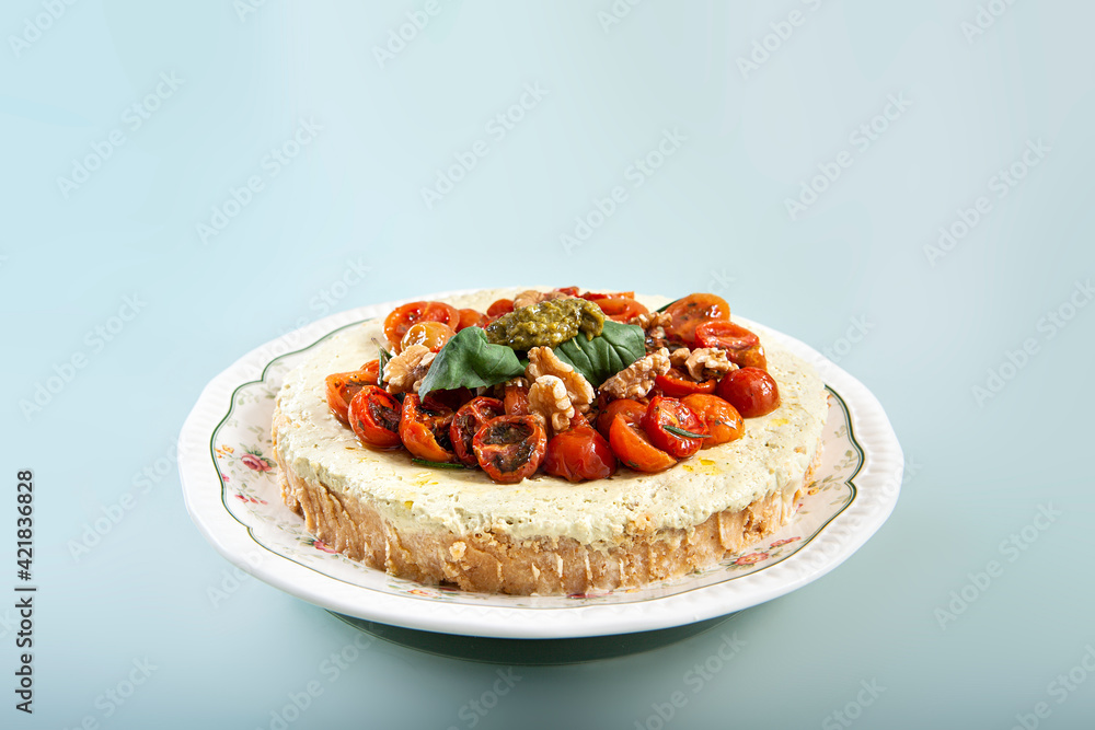 close-up of pesto cheesecake prepared to eat and presented in the center of the table close-up of pesto cheesecake prepared to eat and presented in the center of the table