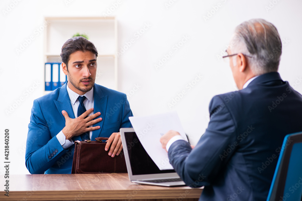 Young male candidate employee meeting with old recruiter Young male candidate employee meeting with old recruiter