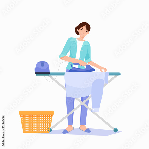 Steam generator. Woman irons a shirt on an ironing board.