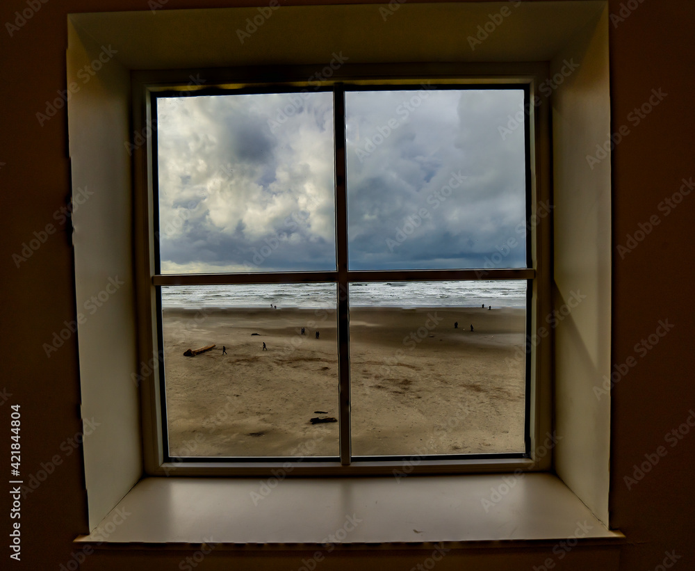 Fototapeta premium Looking through a window with four panes at the beach at Seaside on the Oregon coast