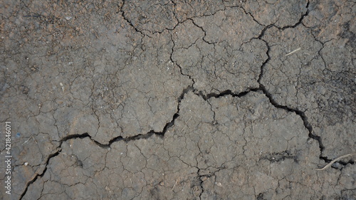 Dry soil surface with sand cracked and drought. Texture background