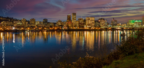Looking west at the reflection of downtown Portland Oregon in the Willamette River at sunset