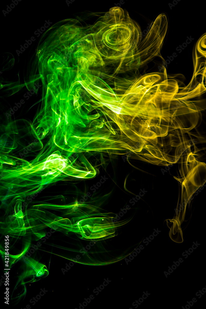 Fototapeta premium Colored smoke on black background