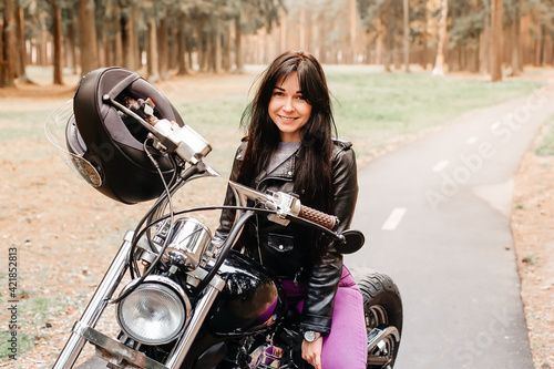 beautiful brunette riding a motorcycle in the park © vilma3000