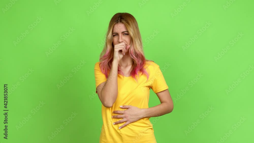 Young blonde woman is suffering with cough and feeling bad over isolated background on green screen chroma key Young blonde woman is suffering with cough and feeling bad over isolated background on green screen chroma key