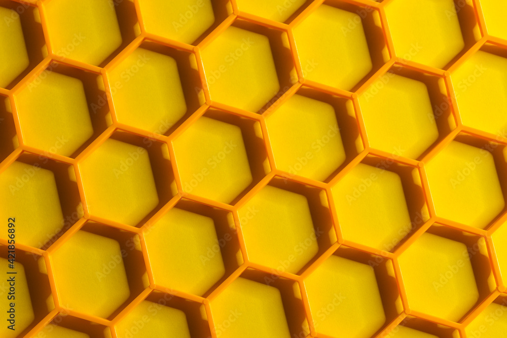 Hexagonal cells grid on a yellow background. Abstract geometric texture. Honeycomb concept Hexagonal cells grid on a yellow background. Abstract geometric texture. Honeycomb concept