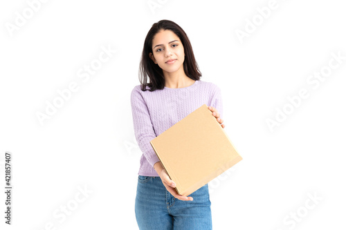 Latin woman with a cardboard box in hands on white background