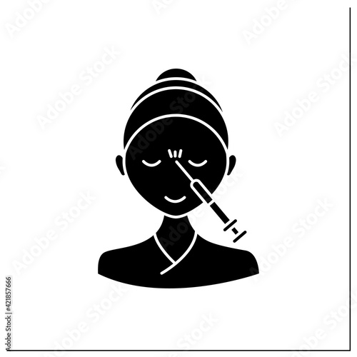 Neurotoxin injection glyph icon.Woman doing injection between eyebrows. Rejuvenation. Full syringe. Beauty cosmetic procedure concept.Filled flat sign. Isolated silhouette vector illustration