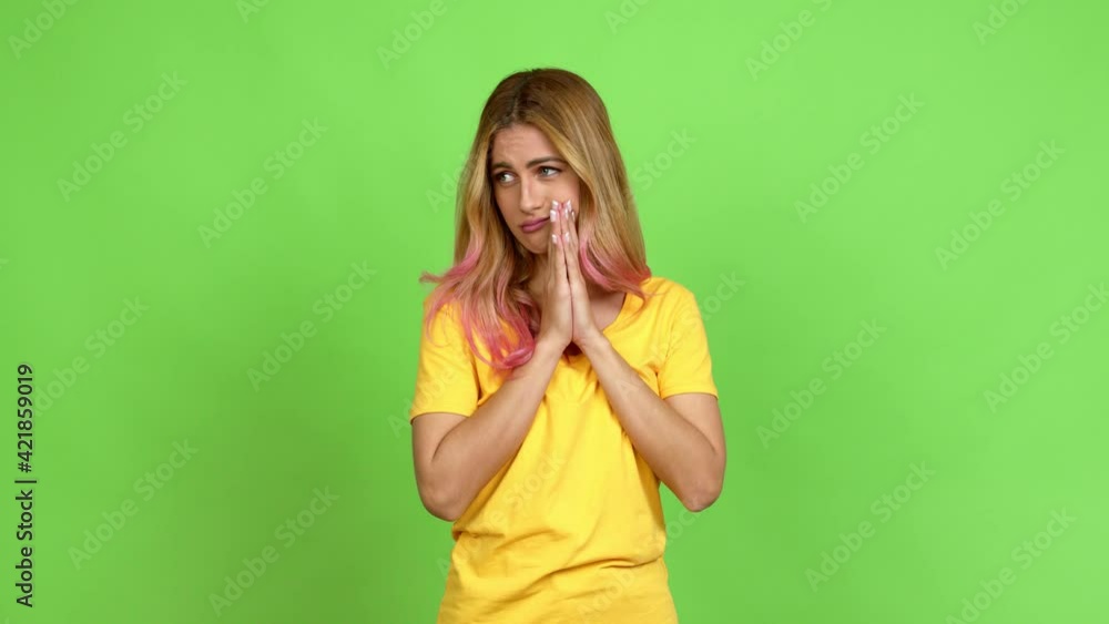 Young blonde woman pleading over isolated background on green screen chroma key Young blonde woman pleading over isolated background on green screen chroma key