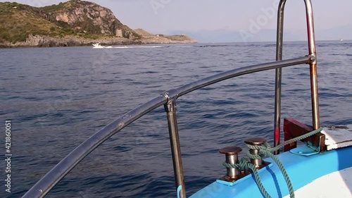 Wallpaper Mural Rocking movement of a leisure motorboat heading against the flow towards the promontory.  Torontodigital.ca