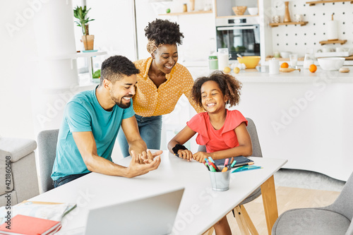 child family woman home happy man father mother lifestyle happiness daughter together parent love bonding cheerful fun table
