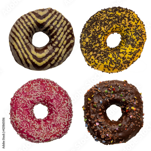Top view of 4 different donuts -brown, yellow, red, chocolate, sprinkles, stripes on a white background