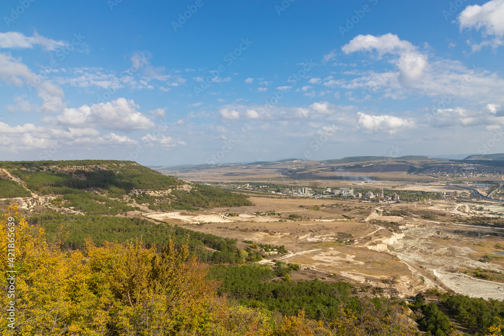 Panoramic view of Bakhchisarai city in central Crimea with industrial zone at foreground