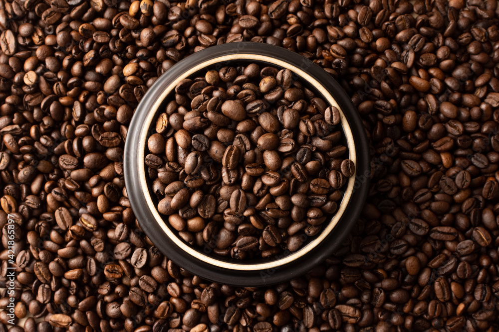 Coffee beans. Coffee beans are spread out on the surface. Coffee beans. Coffee beans are spread out on the surface.