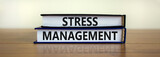 Stress management symbol. Books with words 'Stress management'. Beautiful wooden table, white background. Psychological, business and stress management concept. Copy space.