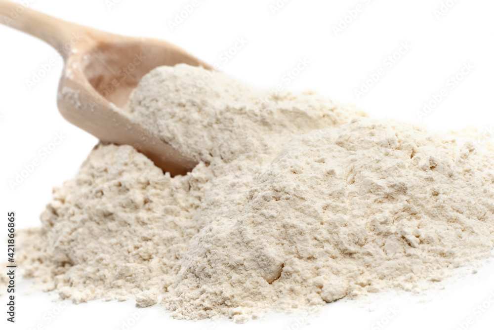 Wheat flour. Flour close-up. An ingredient for baking bread and rolls. Scoop with flour Wheat flour. Flour close-up. An ingredient for baking bread and rolls. Scoop with flour