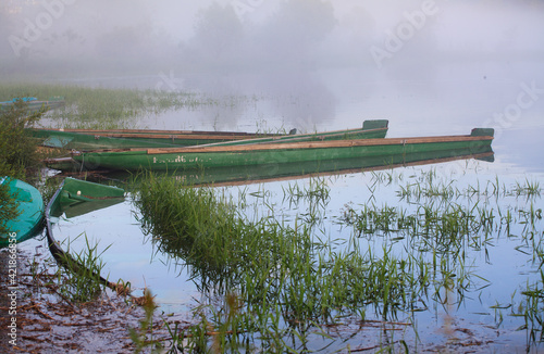 Fototapeta Naklejka Na Ścianę i Meble -  boats on the lake in the fog