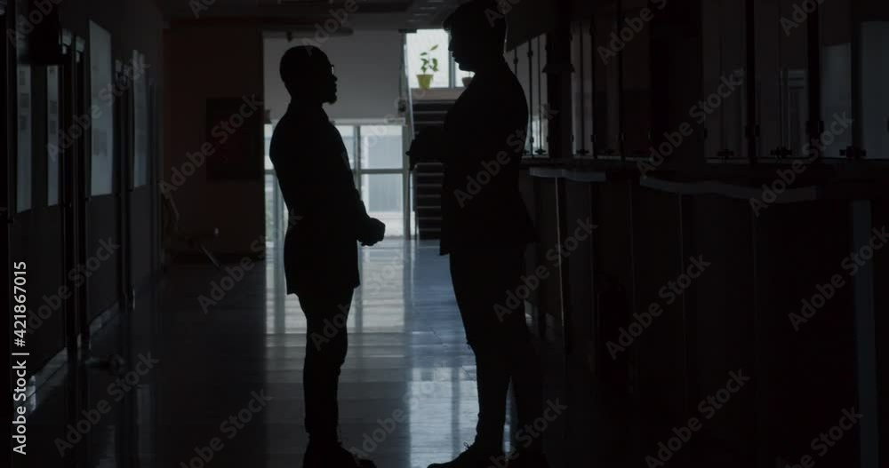 Businessmen talking about work, silhouette Businessmen talking about work, silhouette