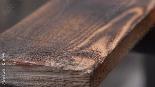 brushing wood with fire, burning wood with fire, burner