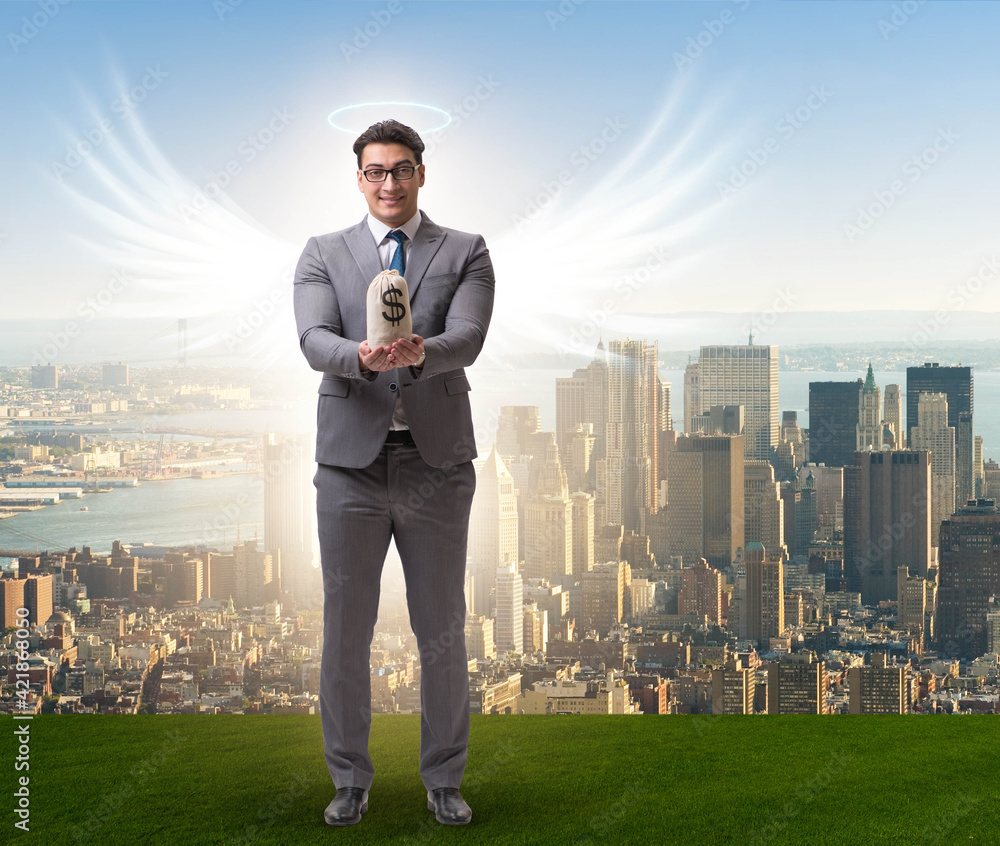 Angel investor concept with businessman with wings Angel investor concept with businessman with wings
