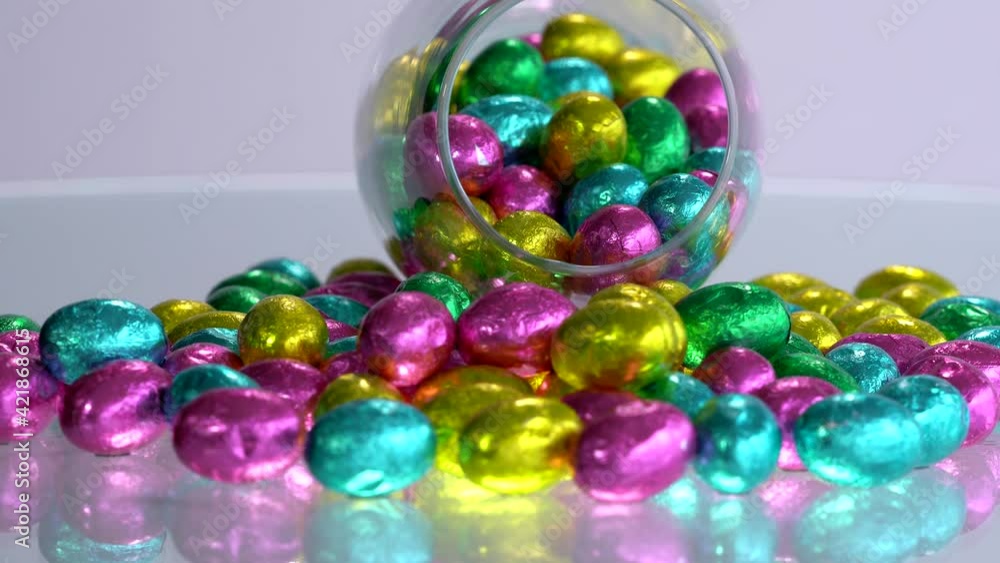 Chocolate Easter eggs wrapped in colorful foil. Chocolate Easter eggs wrapped in colorful foil.