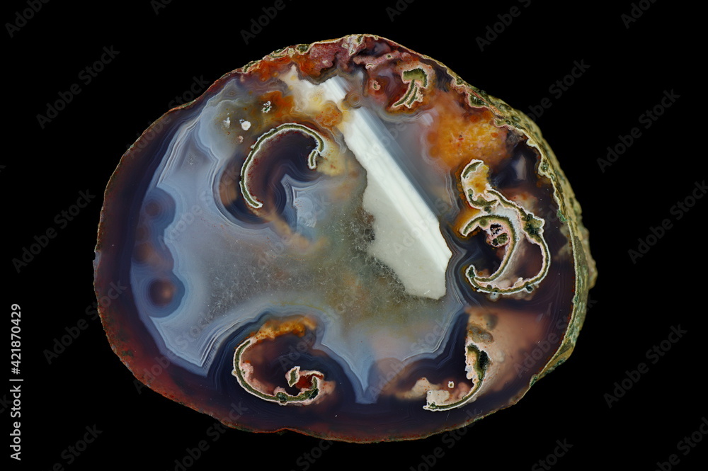 A cross-section of agate. Horizontal agate with quartz-agate fill. Origin: Rudno near Krakow, Poland. A cross-section of agate. Horizontal agate with quartz-agate fill. Origin: Rudno near Krakow, Poland.