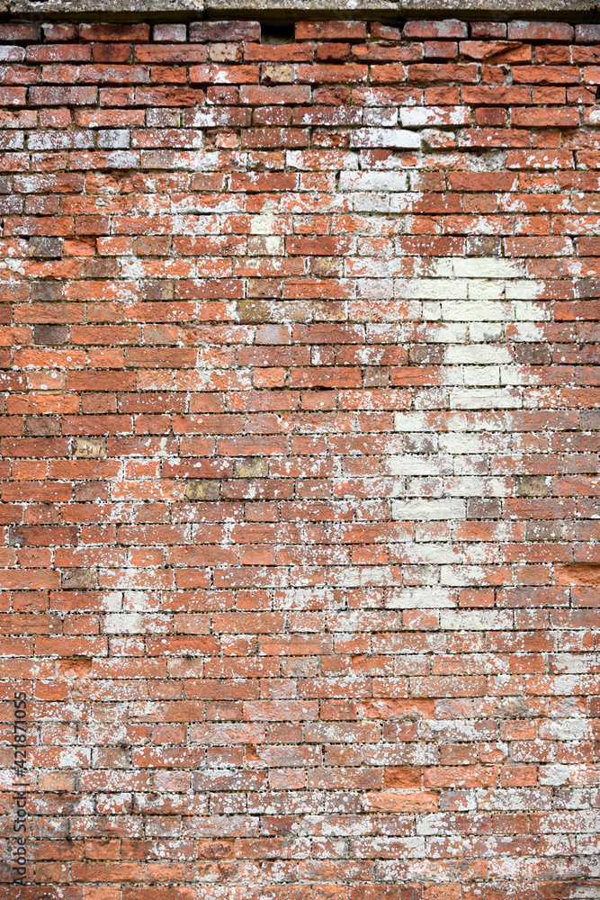 Naklejka premium Brick wall texture of the surface of an old brick wall which has been weathered with age