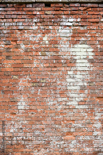 Brick wall texture of the surface of an old brick wall which has been weathered with age