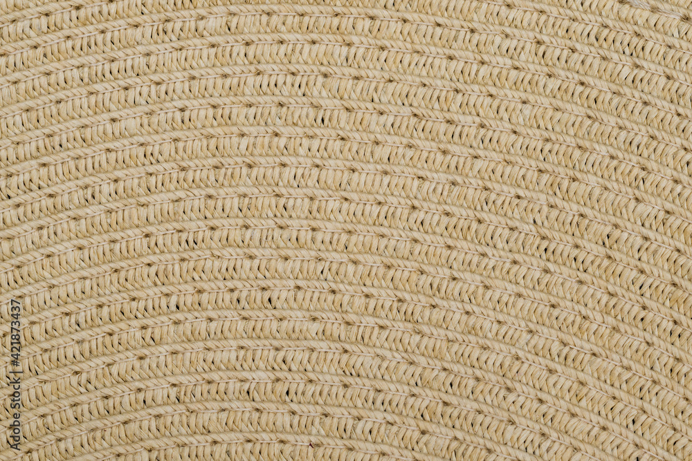 Straw hat texture. Straw weaving. Warp knitting pattern