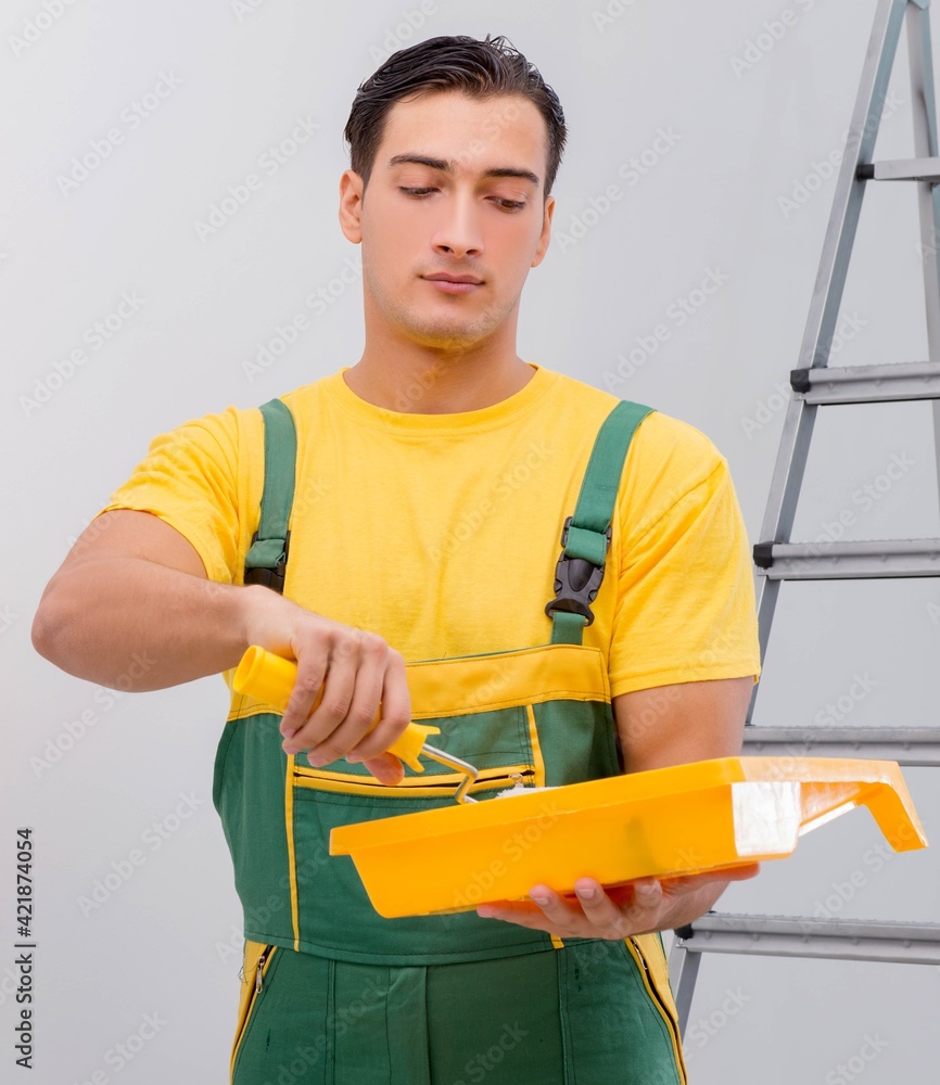Man painting the wall in DIY concept Man painting the wall in DIY concept