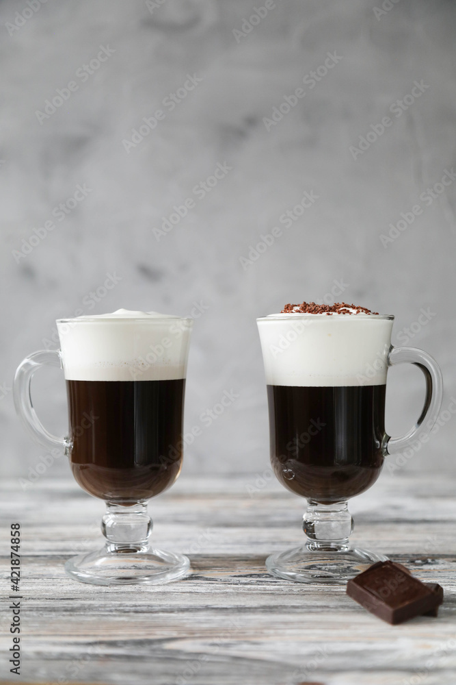 Irish coffee with foam and chocolate on the table Irish coffee with foam and chocolate on the table